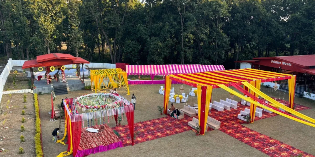 Vibrant outdoor wedding setup with colourful tents and floral decorations at Pristine Woods, ideal for a Destination Wedding in 2025.